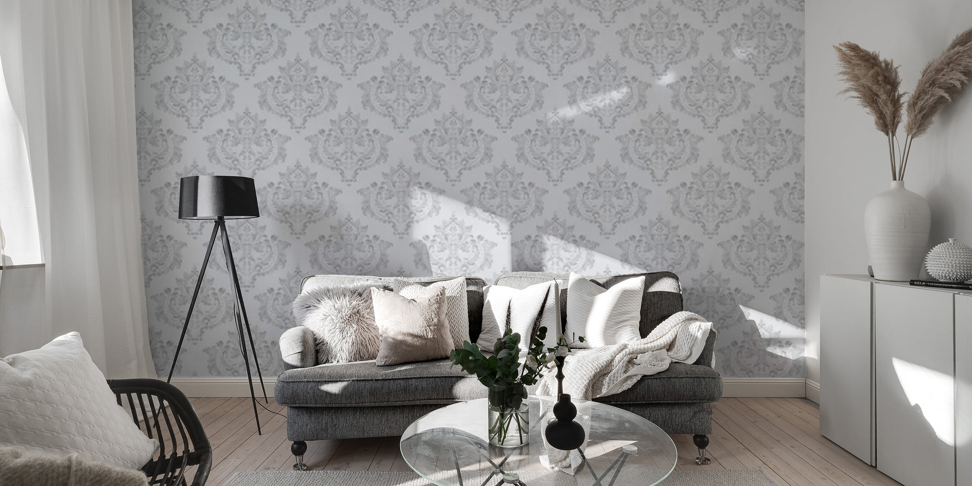 Subtle grey damask repeat wallpaper on a white backdrop.