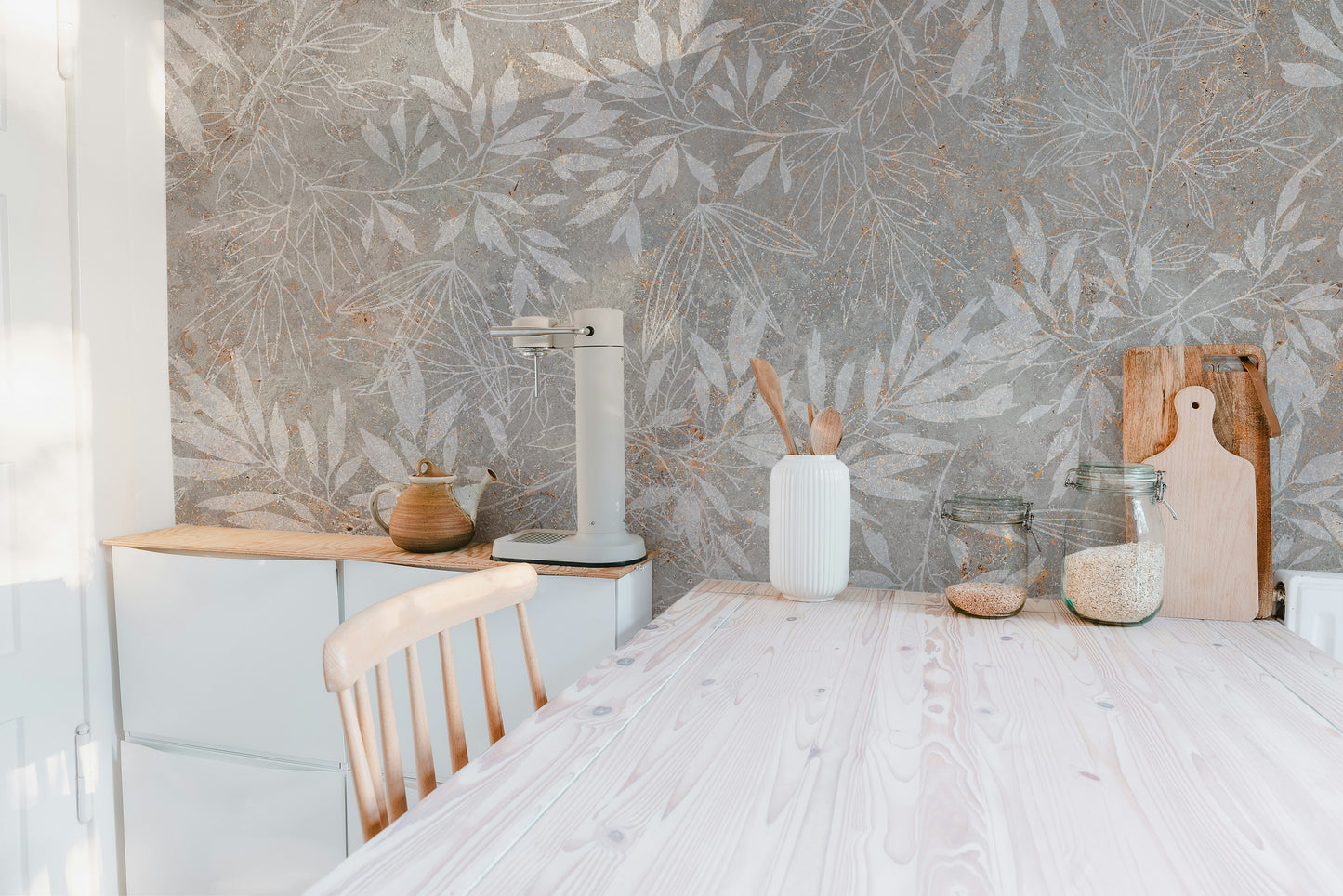 Vintage Floral Artwork wallpaper mural with grey leaves in a kitchen behind a pale-wood counter