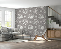 Muted floral tile wallpaper in living room, feature wall behind sofa and minimal wall decor
