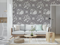 Distressed floral tiles wallpaper in café-style nook, warm lighting and natural wood accents