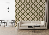 Decorative vintage wallpaper with olive green diamond shapes and centered starbursts.