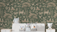 Vintage Green Wildlife wallpaper behind a white bed with owl and bear plush cushions in a kids bedroom
