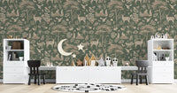 Vintage Green Wildlife wallpaper behind a long study desk with black chairs and wood moon and star decor