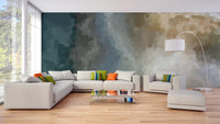 Vintage Grunge Watercolor Paint Stains wallpaper mural in teal and tan behind a cream sectional sofa in a living room