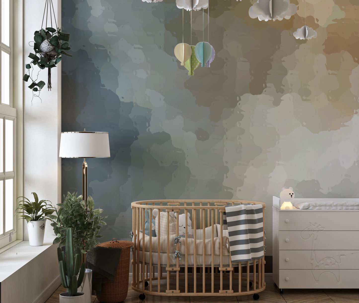 Vintage Grunge Watercolor Paint Stains wallpaper mural in blue and tan in a nursery with a wooden crib and white dresser