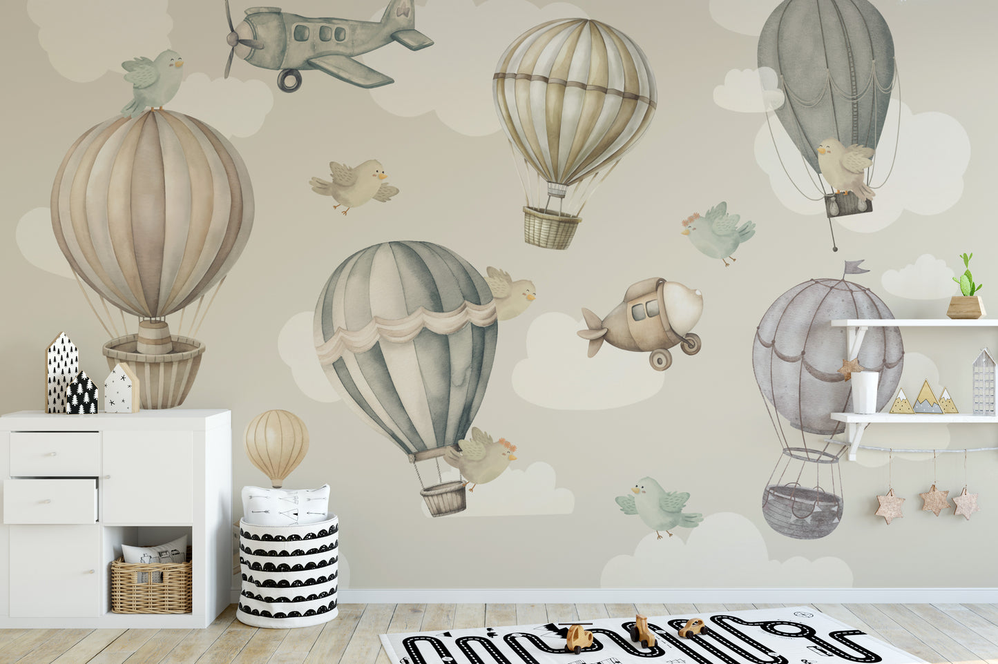 Vintage Hot Air Balloon Nursery wallpaper mural with balloons beside a white dresser and star wall shelf