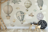Vintage Hot Air Balloon Nursery wallpaper mural of balloons by a wooden loft-bed ladder and round chalkboard