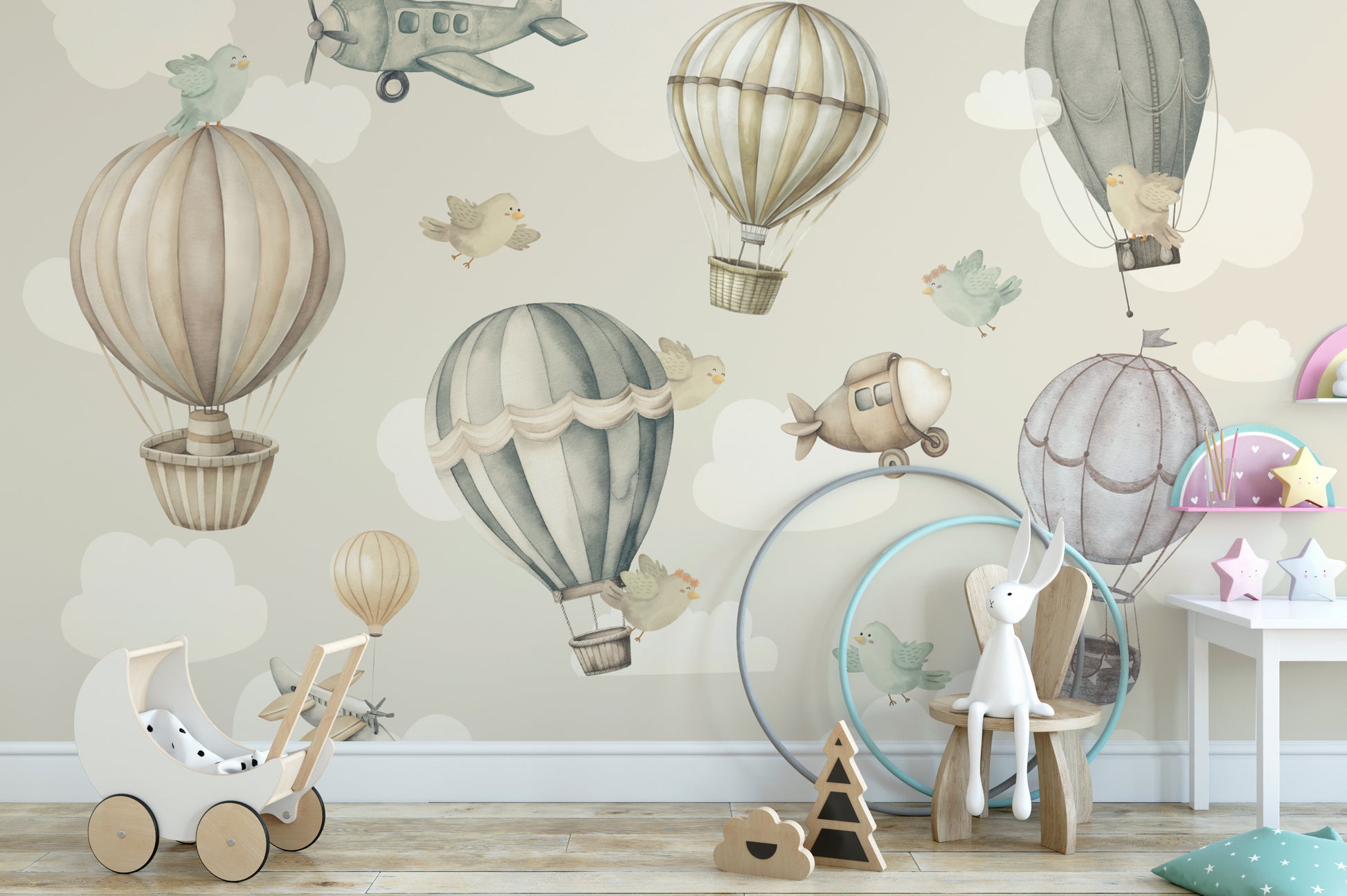 Vintage Hot Air Balloon Nursery wallpaper mural of pastel balloons and planes above a white toy pram and bunny