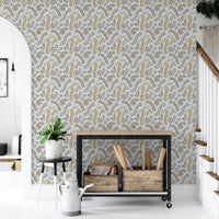 Vintage Foliage Golden and Gray wallpaper beside an industrial console cart and stairs in a hallway