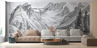 Vintage Mountain wallpaper mural with pine trees behind beige sectionals and a round gold coffee table
