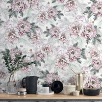 Vintage Peony Floral wallpaper mural in pink and sage behind a wood shelf with black pitcher and brass decor