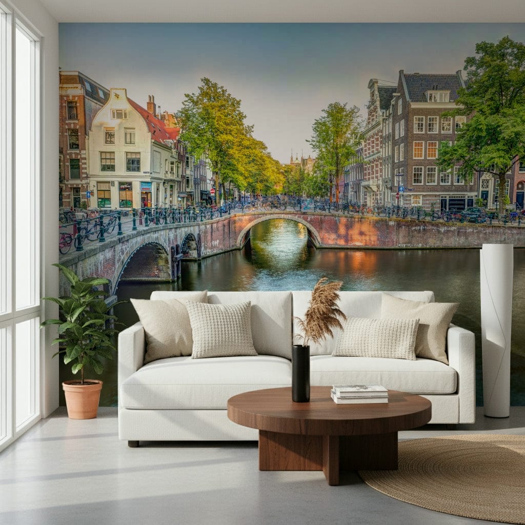 Visit Amsterdam wallpaper mural of canal houses behind a white sofa and round walnut coffee table in a living room