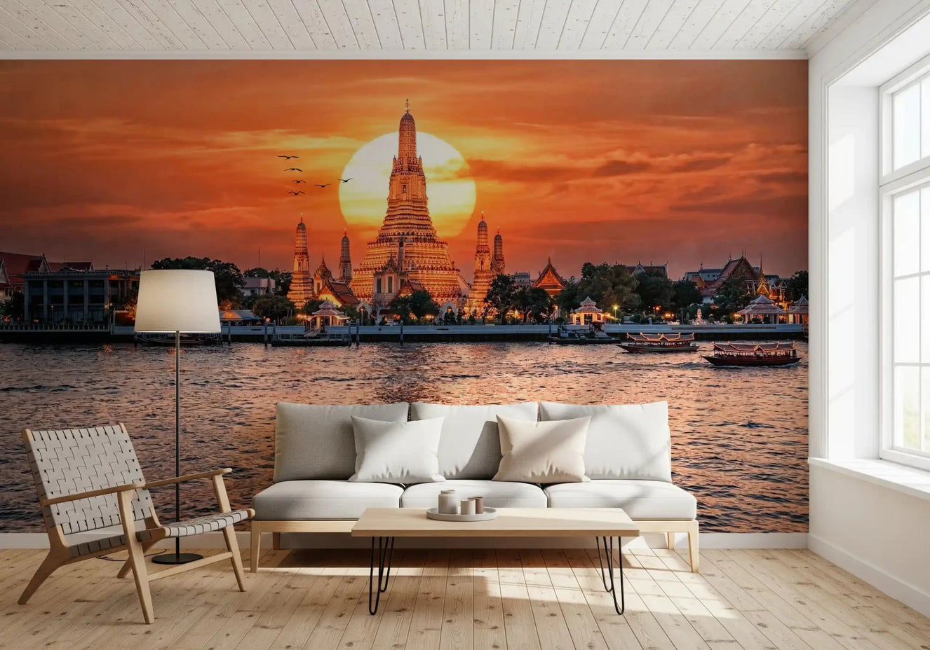 Living room with Wat Arun sunset wall mural and glowing river view