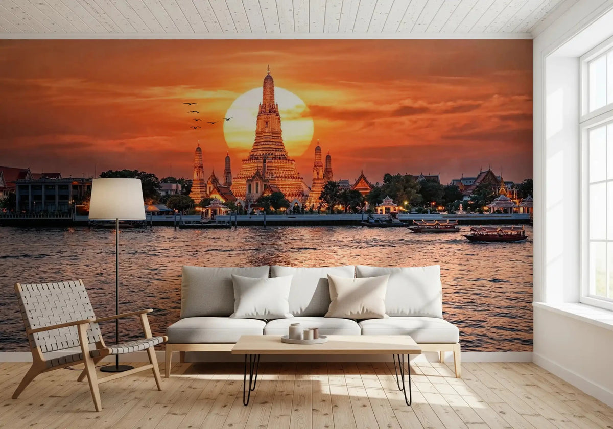 Living room with Wat Arun sunset wall mural and glowing river view