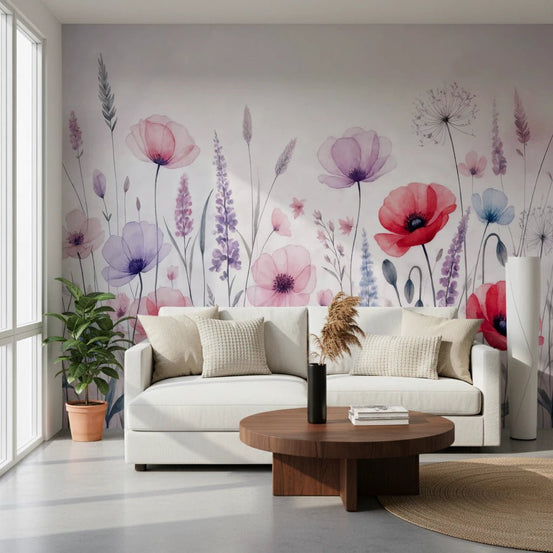 Watercolor Bloomscape wallpaper mural of pink and red poppies and lavender behind a white sofa with a round walnut table