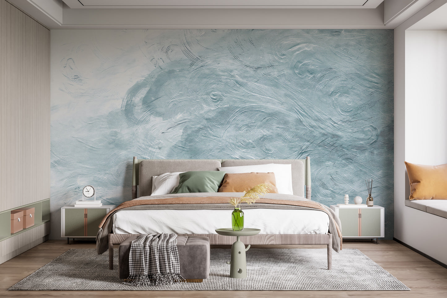Watercolor Blue Waves wallpaper mural styled as a living room feature wall behind a sofa and seating in blue tones