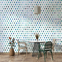 Light blue dot mural with watercolor texture and minimalist design.

