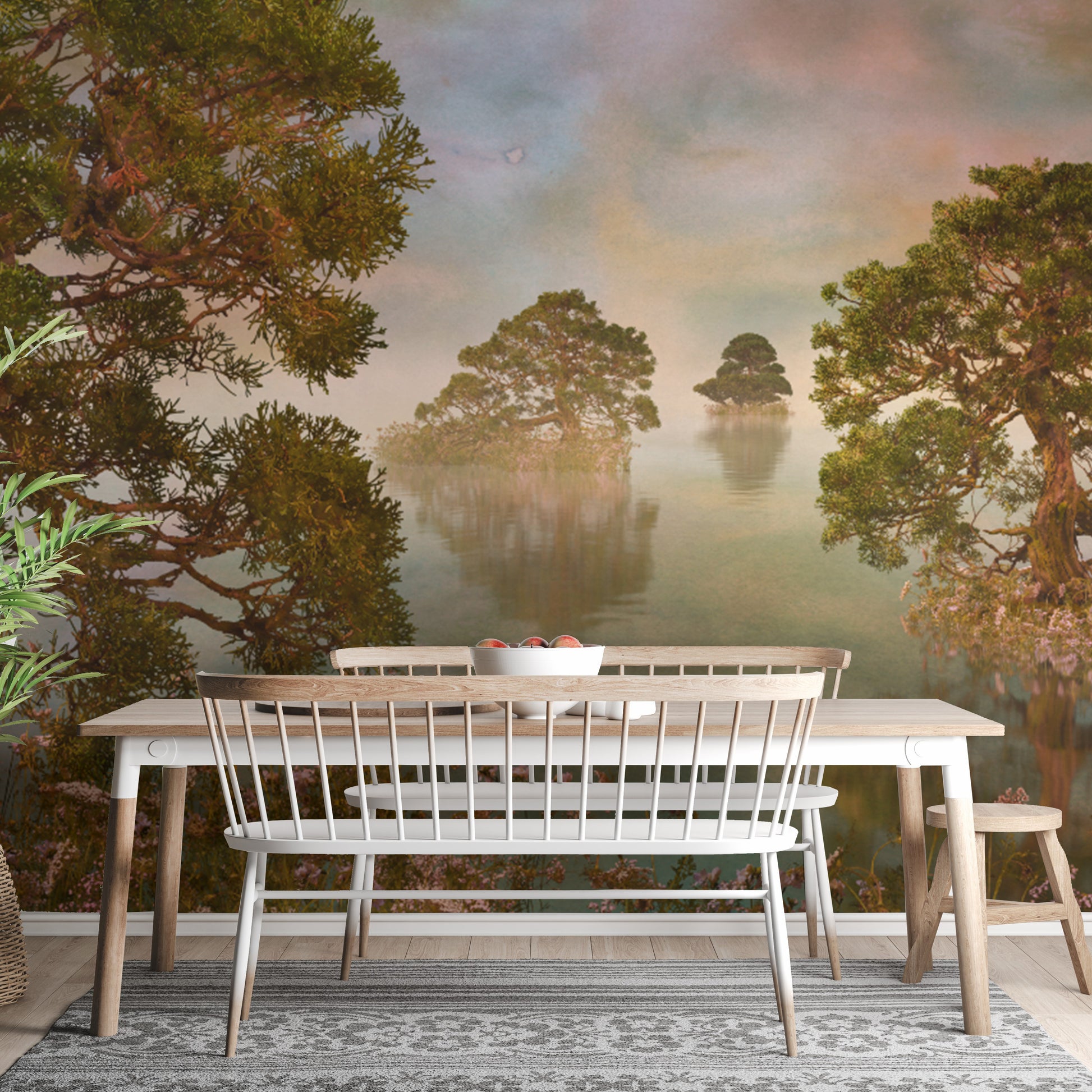 Watercolor Lake Sunset Forest wallpaper mural behind a light wood dining table and white spindle bench