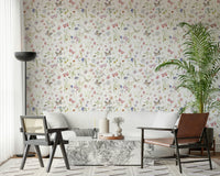 Delicate spring-themed wallpaper, a cheerful meadow full of pink and blue wild blooms.