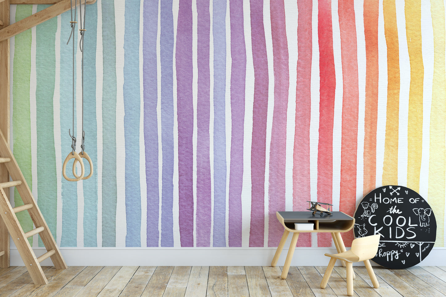 Watercolor Rainbow Striped wallpaper mural in watercolor rainbow stripes behind a white bunny and dreamcatcher canopy in a nursery
