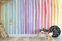 Watercolor Rainbow Striped wallpaper mural in watercolor rainbow stripes behind a white bunny and dreamcatcher canopy in a nursery