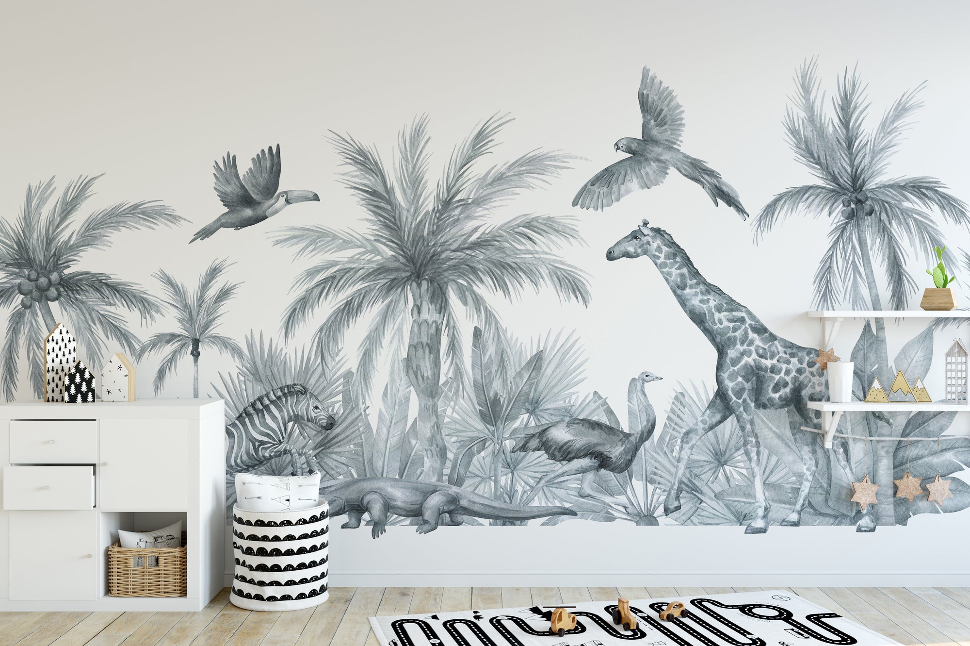 Watercolor Wild Animals wallpaper mural in gray with giraffe, palms and birds above a white dresser in a kids room