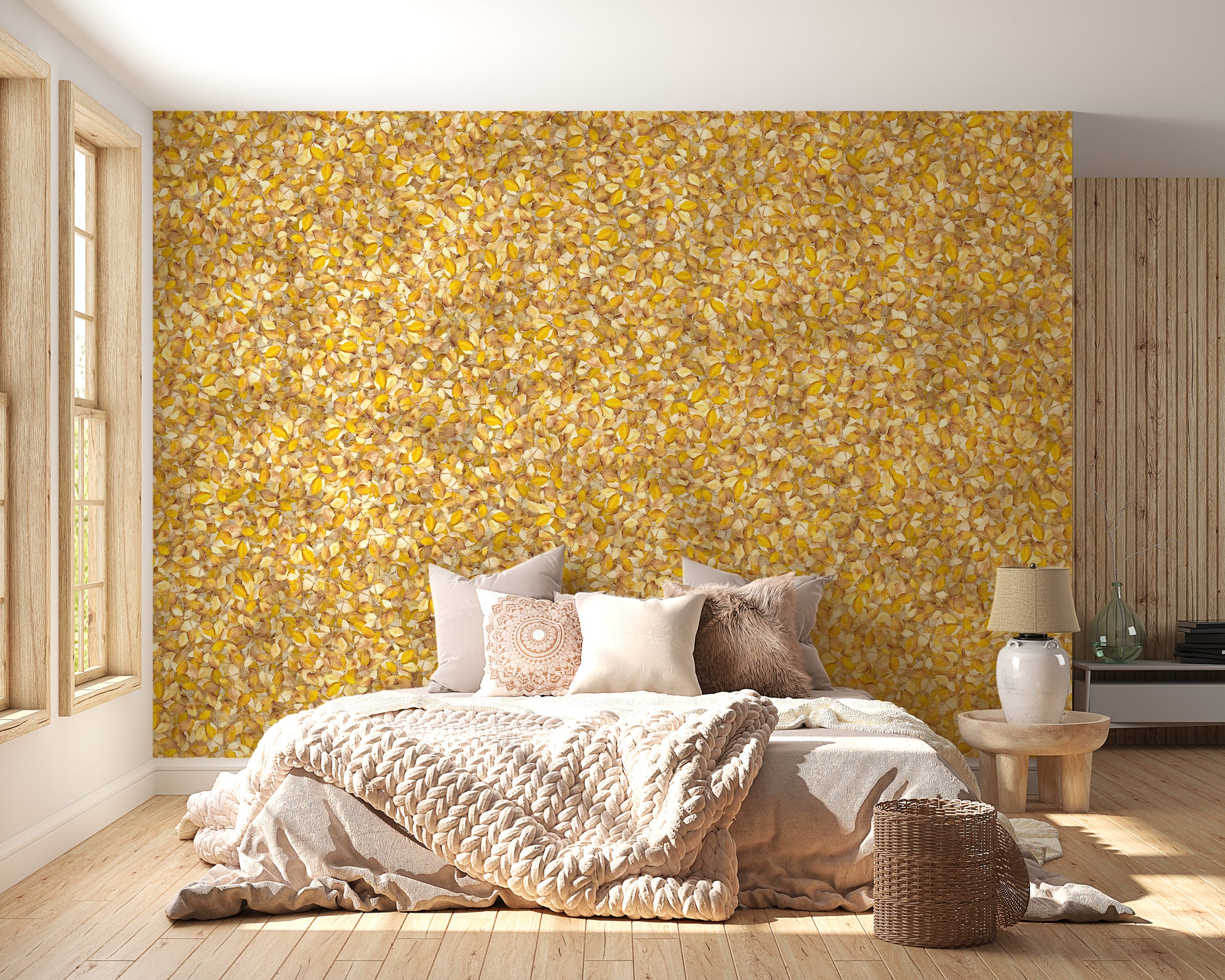 Watercolor Yellow Leaves wallpaper mural behind a bed with neutral bedding in a sunlit bedroom