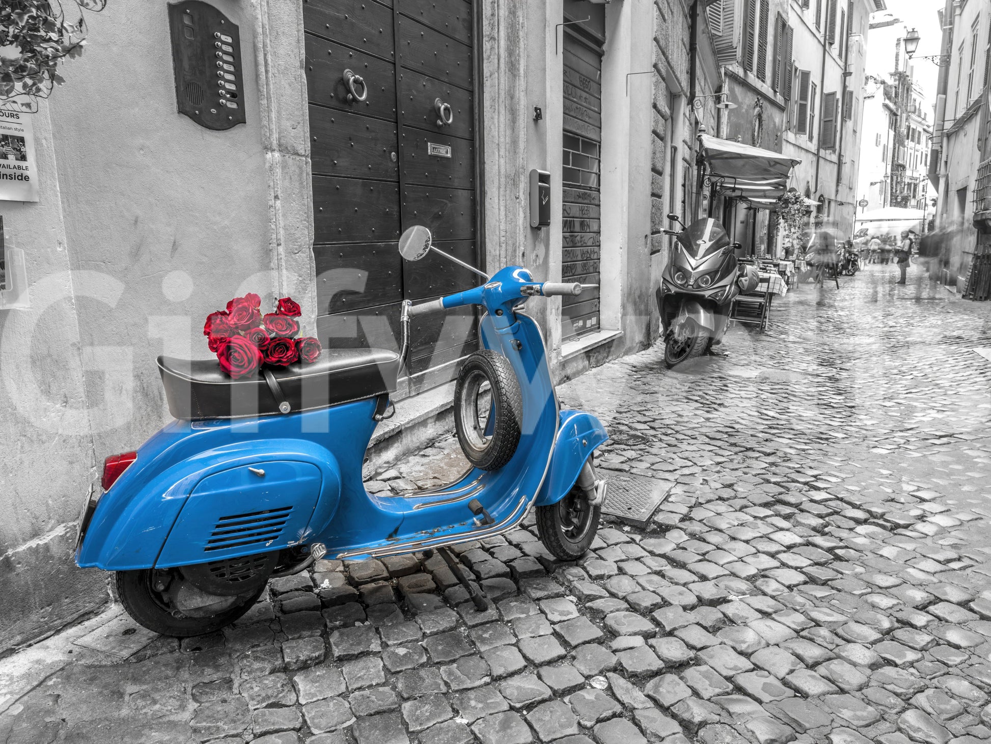 The image captures the unique style of a vintage scooter.

