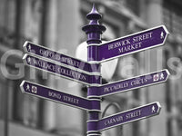 The wallpaper presents a vibrant Oxford Circus signpost standing out against a soft-focus architectural backdrop.