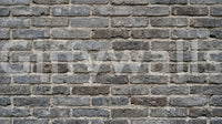 Textured brick wall mural in urban gray with a worn masonry finish
