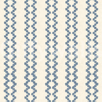 Cream backing balances the slate blue zellige ornament in this striped wallpaper