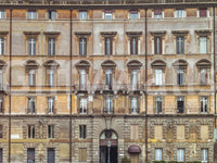 Worn ochre stucco and shutters give this European wall mural a lived-in feel.