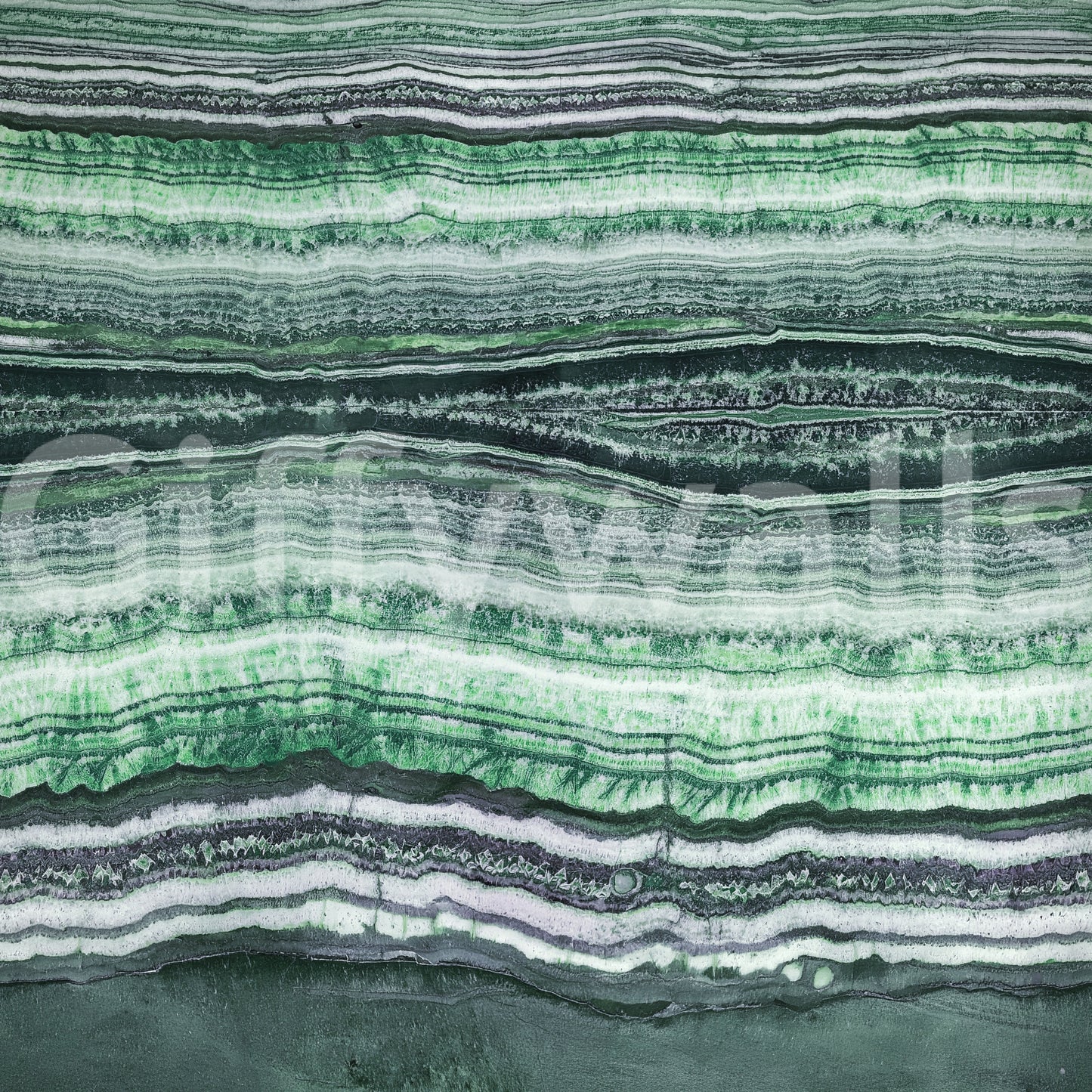 Ribbon-like stone striations stretch from edge to edge of the wall mural