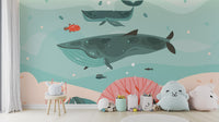 Bright ocean voyage wallpaper with diving whales.