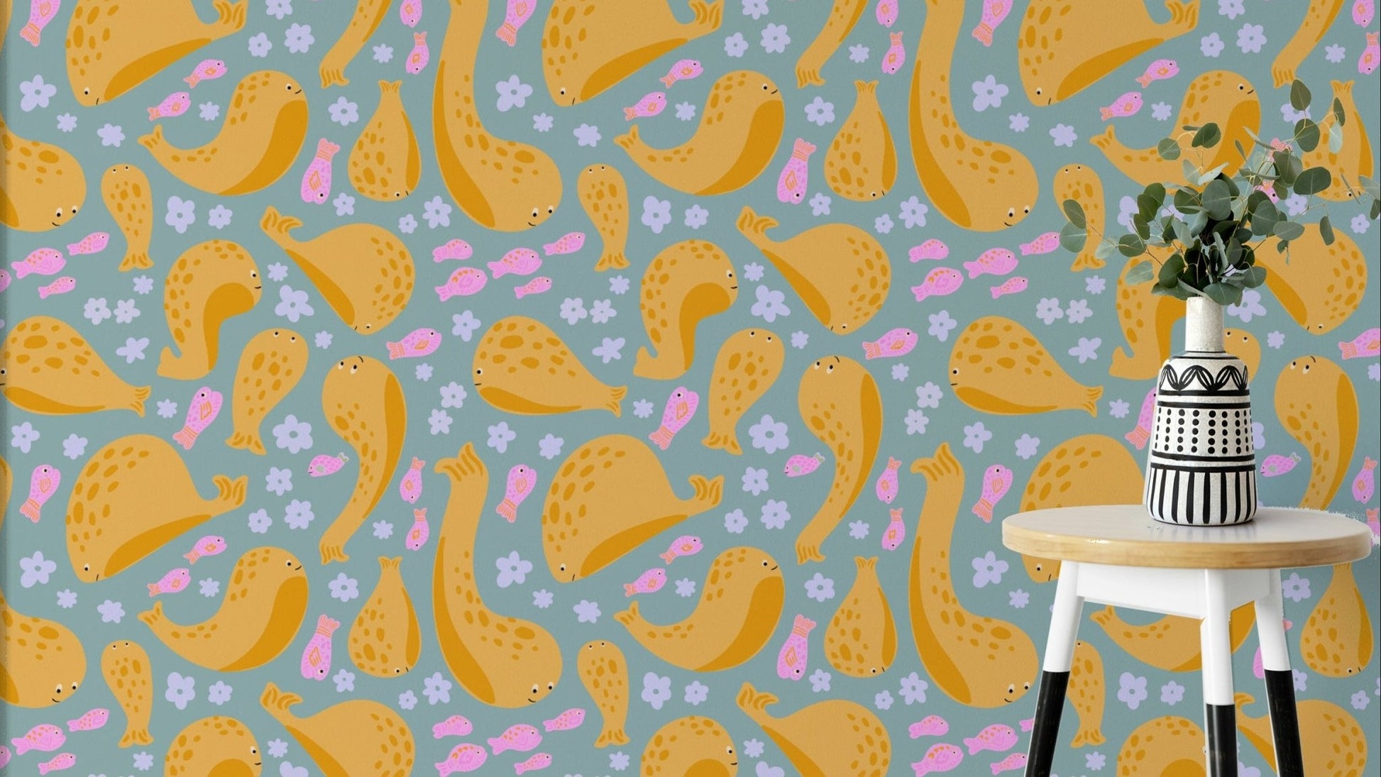 The image shows a pattern of playful whales.

