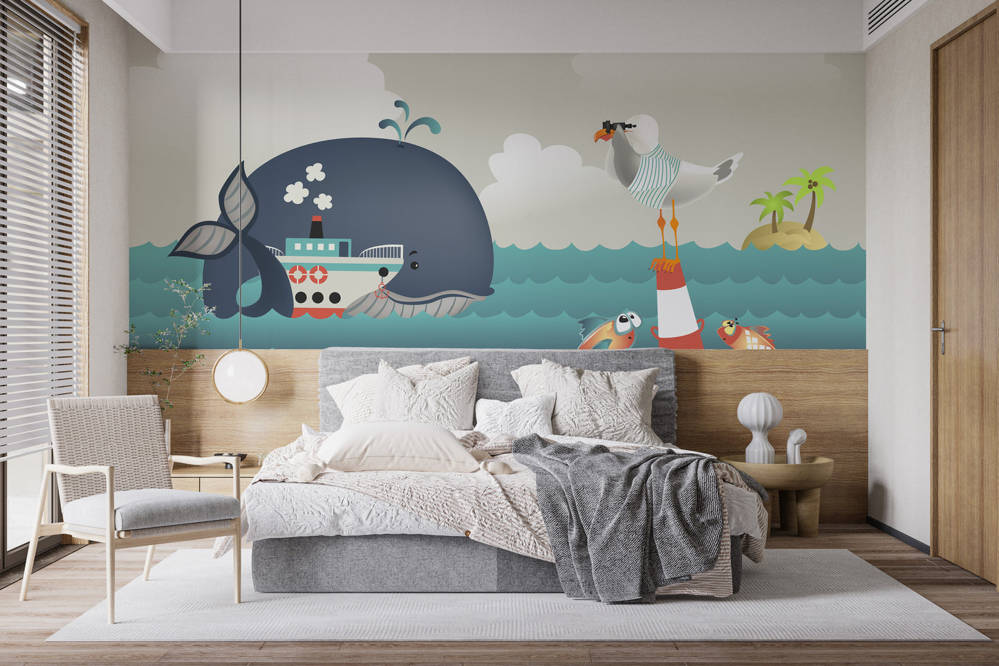 Whale & Steamer Kids wallpaper mural styled as a feature wall behind a dining table and chairs in blue tones