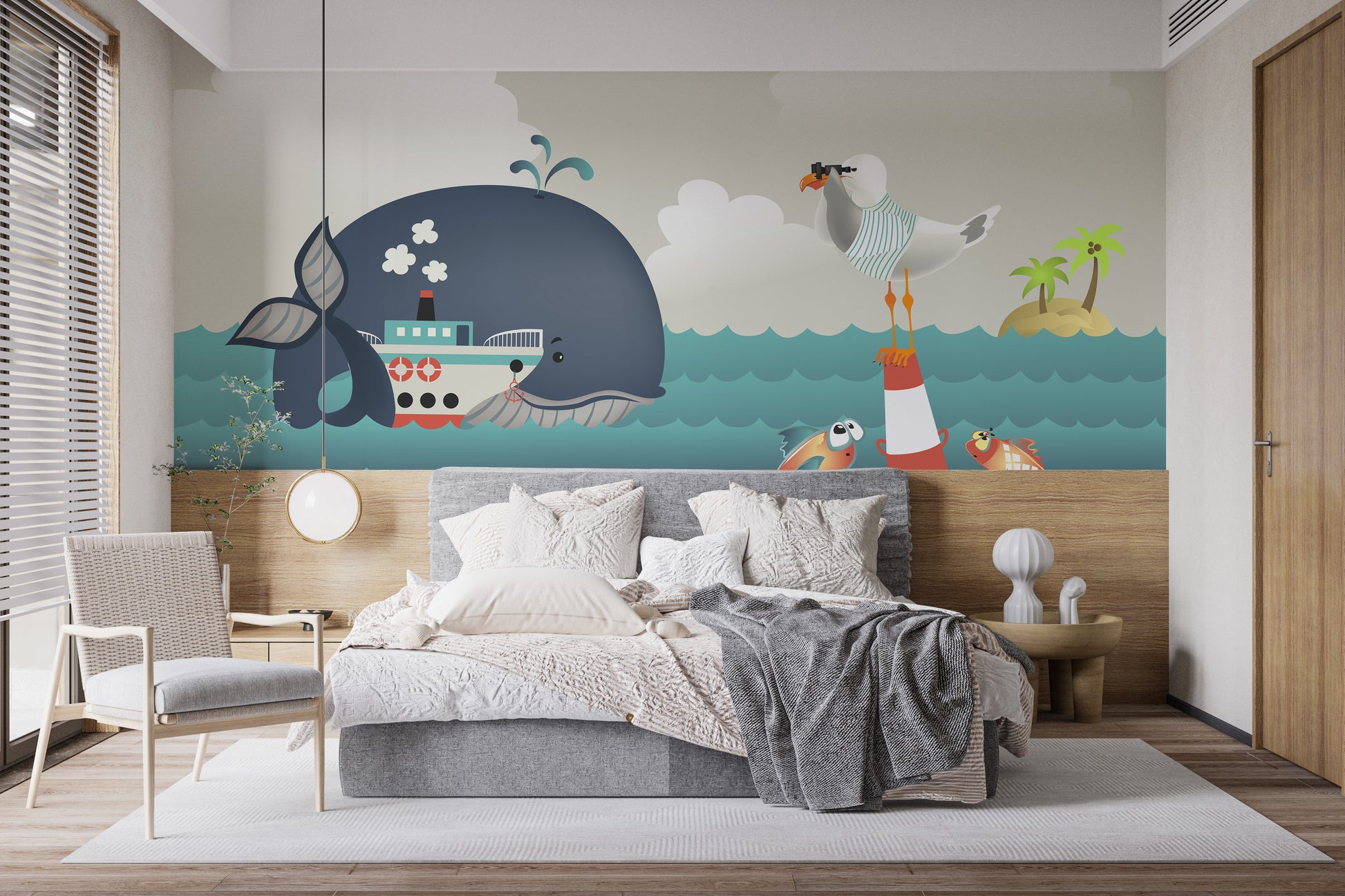Whale & Steamer Kids wallpaper mural styled as a feature wall behind a dining table and chairs in blue tones