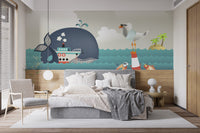 Whale & Steamer Kids wallpaper mural styled as a feature wall behind a dining table and chairs in blue tones