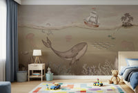 Underwater whale wallpaper in home office, calming marine artwork for a feature wall.