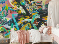 Urban Sprawl Symphony wallpaper mural of a bold abstract cityscape in a girls room with white iron canopy bed and pink bedding