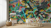 Urban Sprawl Symphony wallpaper mural with multicolor city art in a kids playroom with bunny-ear chairs and a cloud cushion