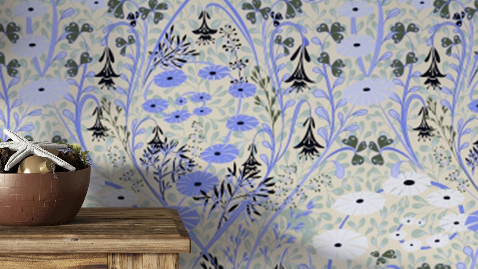 Whimsical Meadow Periwinkle wallpaper in blue and cream florals behind a copper bowl on a wooden console table