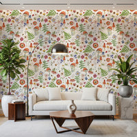 Whimsical Watercolor Meadow wallpaper mural in a living room with a white sofa, arc lamp and tall green plants