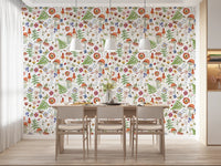 Whimsical Watercolor Meadow wallpaper mural in a dining room with a light wood table under three pendant lamps
