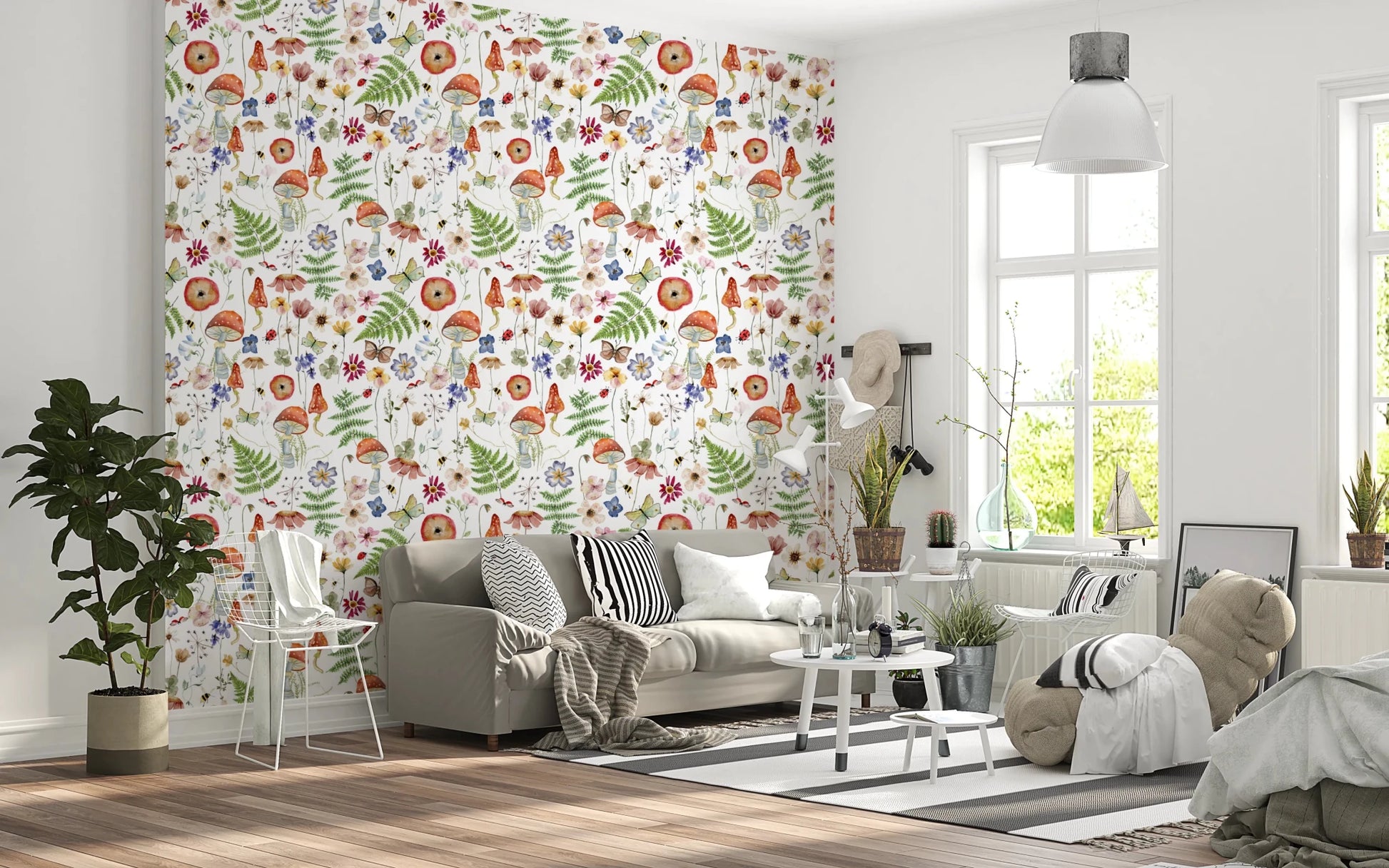 Whimsical Watercolor Meadow wallpaper mural in a living room with a grey sofa, striped cushions and round table