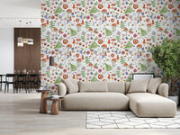 Whimsical Watercolor Meadow wallpaper mural in an open-plan living room with a beige sectional and dining area