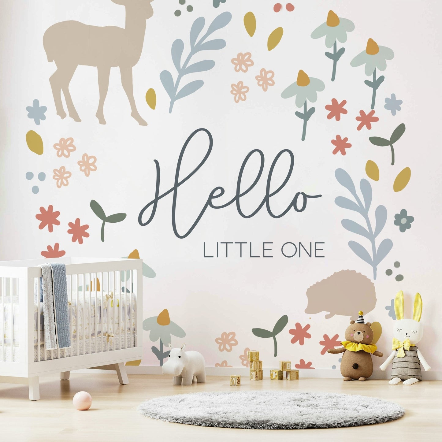 Nature-inspired wall mural featuring woodland creatures.


