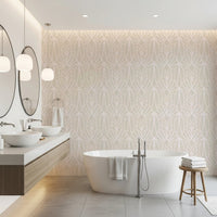 Whispered Arches wallpaper in soft beige with a pale Art Deco arch pattern behind a freestanding white tub in a bathroom