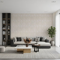 Whispered Arches wallpaper with a pale cream arch motif behind a grey sectional sofa and tall bookshelf in a living room