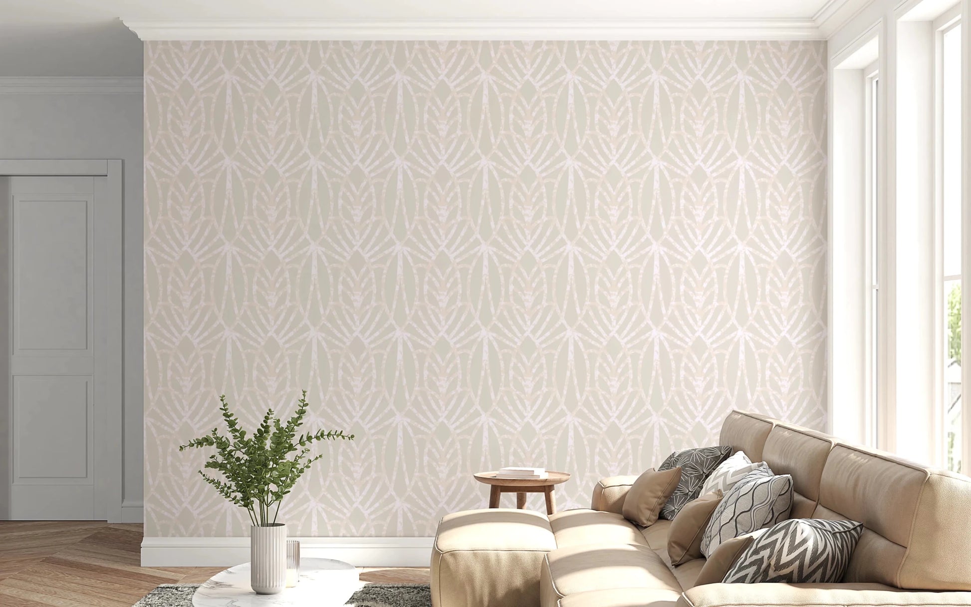 Whispered Arches wallpaper in pale beige arch pattern behind a tan leather sectional sofa in a bright living room